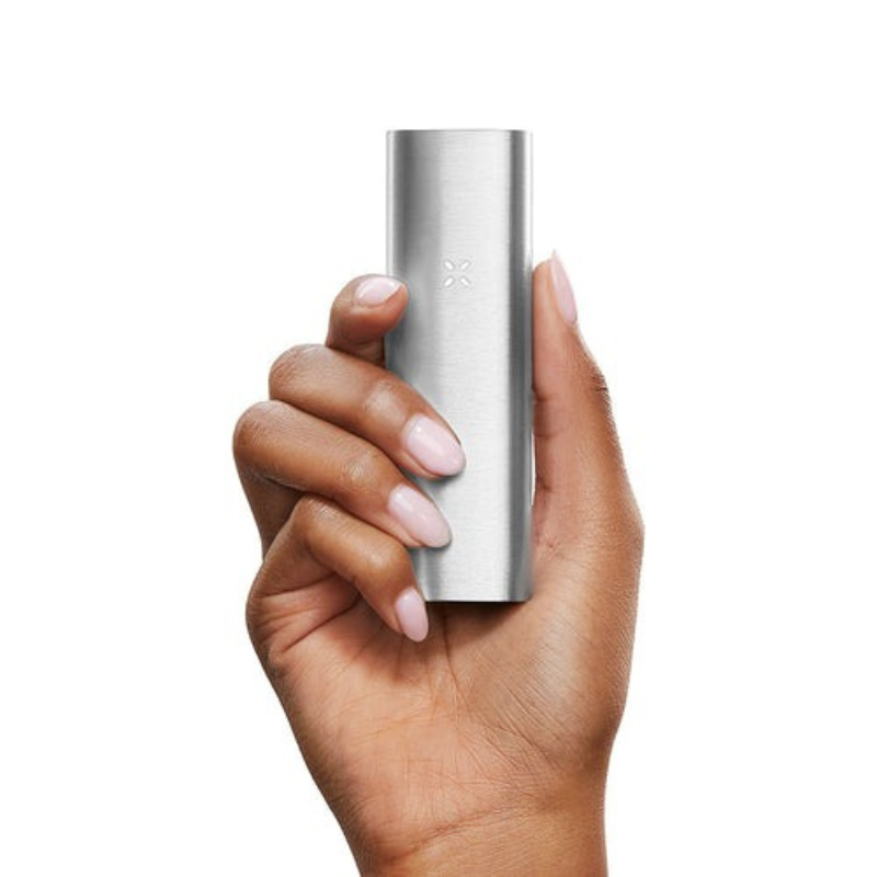 Hand holding Pax 2 portable vaporizer for dry herb